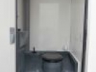 Toaleta mobilní buňky pro stavebnictví s elektrickým topením